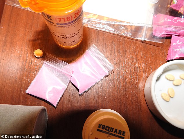 98541047-14728439-Other_images_show_a_mysterious_pink_powder_in_small_bags_alongsi-a-4_1747689189422