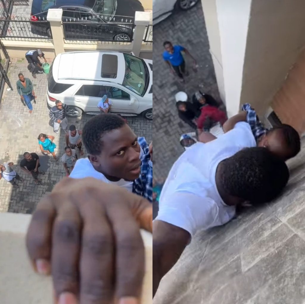 Man Hold Baby Tight While Hanging From Balcony As Fire Burn Building For Lagos.